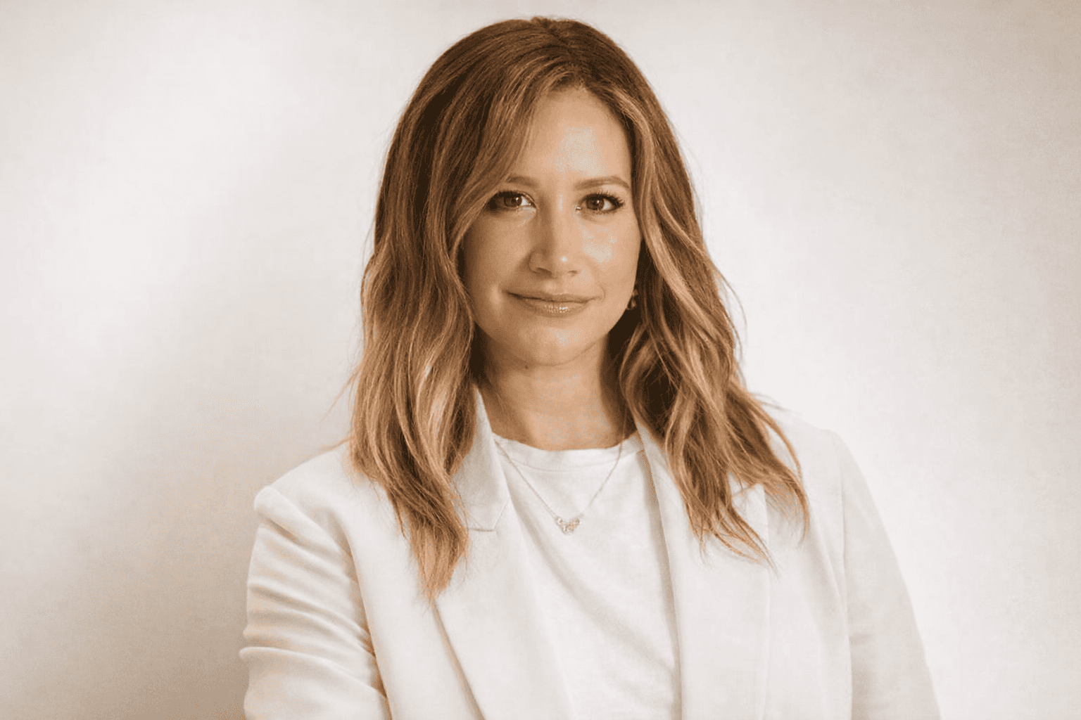 Editorial portrait used in an article about Ashley Tisdale, highlighting themes of career evolution, wellness, and personal growth